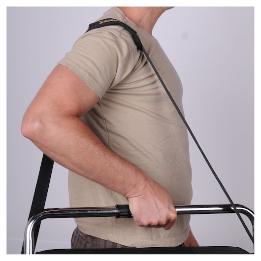 STANLEY 1-70-719 carrying strap in use, close-up side angle, strapped over shoulder holding metal handle.
