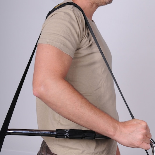 Photo of STANLEY 1-70-719 shoulder harness for carrying heavy items, shown worn by a person.