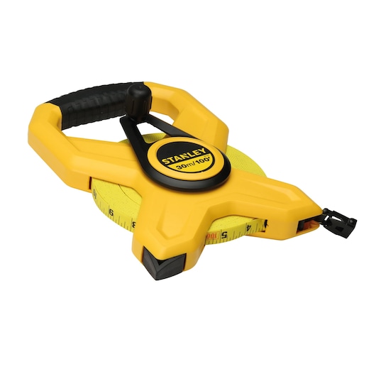 STANLEY 34-791 open reel yellow measuring tape with black handle, photography on white background.