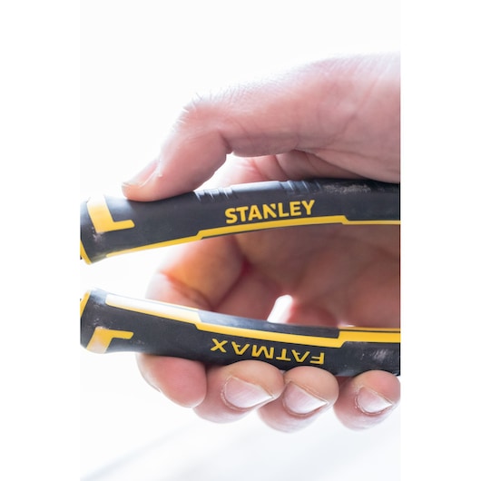 Close-up photo of STANLEY FATMAX 89-868 pliers handles with black and yellow grip, hand holding tool.