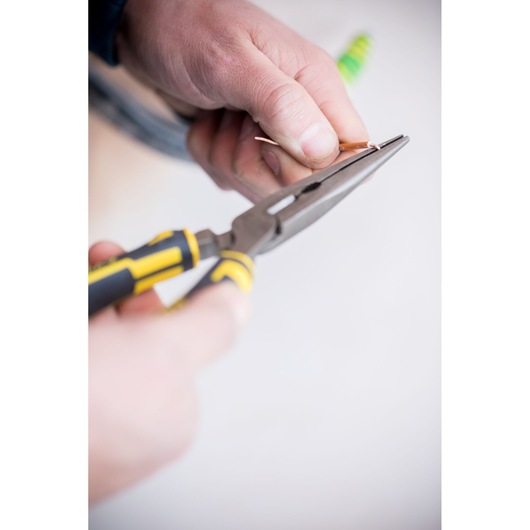 Photo of STANLEY 89-870 long nose pliers with yellow and black handle in use gripping a wire.