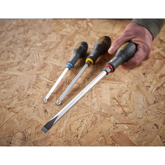 STANLEY FMHT0-62621 screwdriver set with black handles, flat and Phillips tips, angled on wood surface.