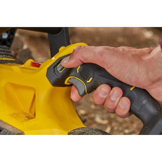 STANLEY SFMCCS630M1 close-up of black and yellow tool handle with trigger in use, product photography.