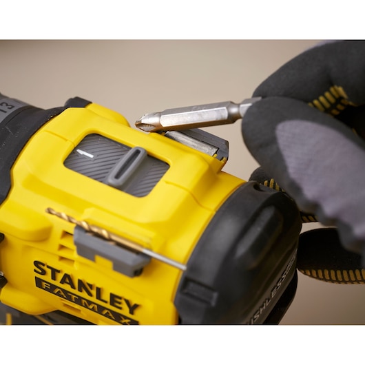 Photo of STANLEY SFMCD726D2K drill close-up showing bit holder and storage feature.