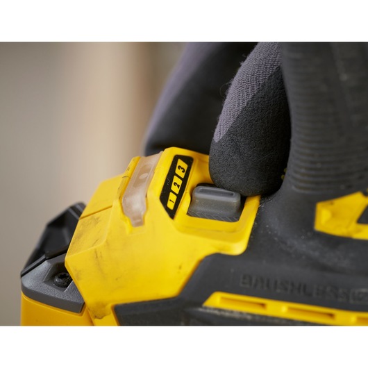 STANLEY SFMCF830D2K power tool speed control close-up, yellow and black, photography.