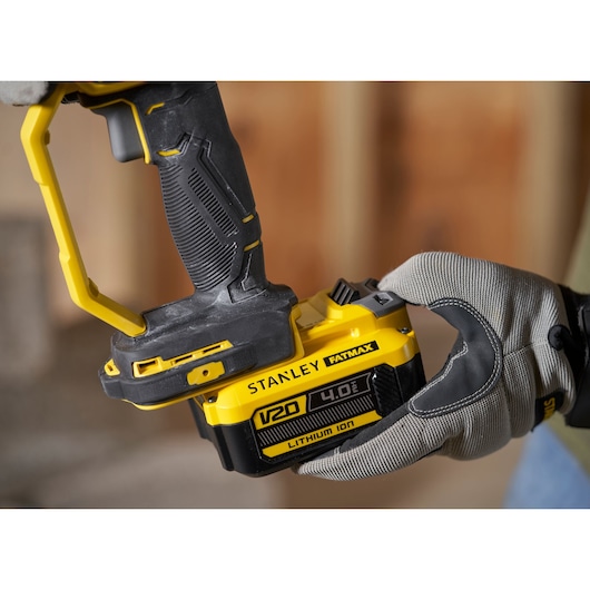 Photo of STANLEY SFMCG400M1S V20 cordless tool with yellow and black handle, close-up view.