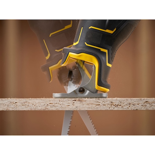 STANLEY SFMCS311B-XJ reciprocating saw close-up action cutting wood, photography.